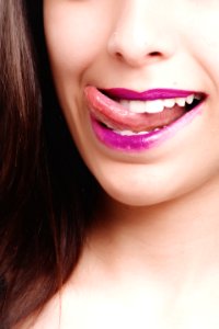 Woman Licking With Purple Lips