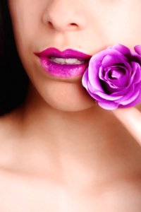 Woman With Pink Lipstick Holding Pink Rose photo