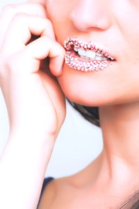 Woman With Earrings On Lips photo