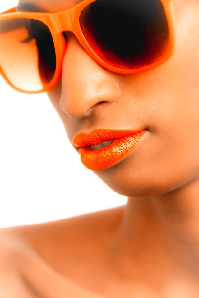 Closeup And Selective Focus Photograph Of Woman Wearing Orange-framed Wayfarer-style Sunglasses