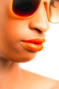 Woman Wearing Orange-framed Sunglasses And Orange Lipstick photo