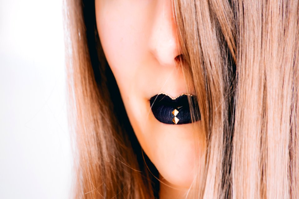 Close-up Photograph Of Woman Wearing Black Lipstick
