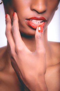 Woman With Red Lipstick And Red Manicure
