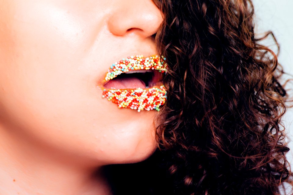 Woman With Sprinkle On Lips