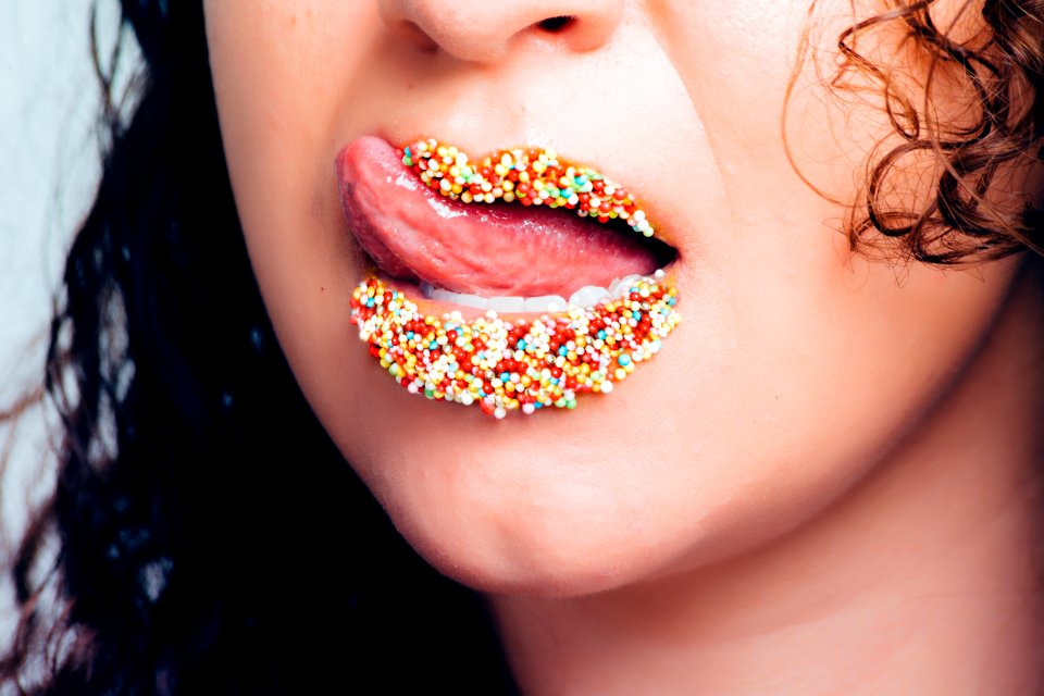 Woman With Candy Sprinkles On Lips