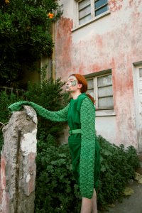 Woman Wearing Green Long-sleeved Costume With Face Paint photo