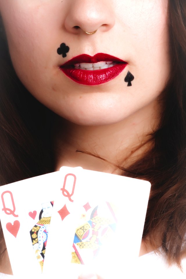Woman Holding Queen Of Hearts And Diamonds