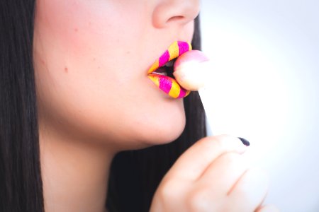 Woman Holding A Lollipop