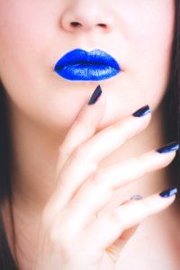 Woman Wearing Blue Lipstick And Manicure
