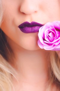 Portrait Photo Of Womans Purple Matte Lipstick photo