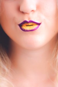 Woman With Purple And Yellow Lipstick