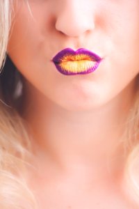 Woman Wearing Purple And Yellow Lipstick