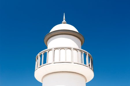 White Lighthouse Under Blue Sky photo