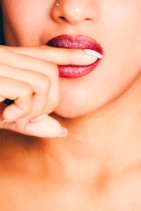 Woman Biting Index Finger