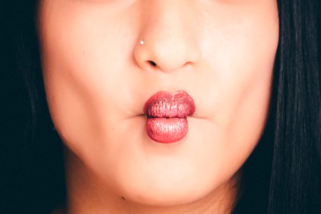 Woman Wearing Red Lipgloss photo