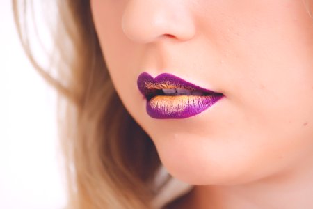 Woman Wearing Purple And Beige Lipstick photo