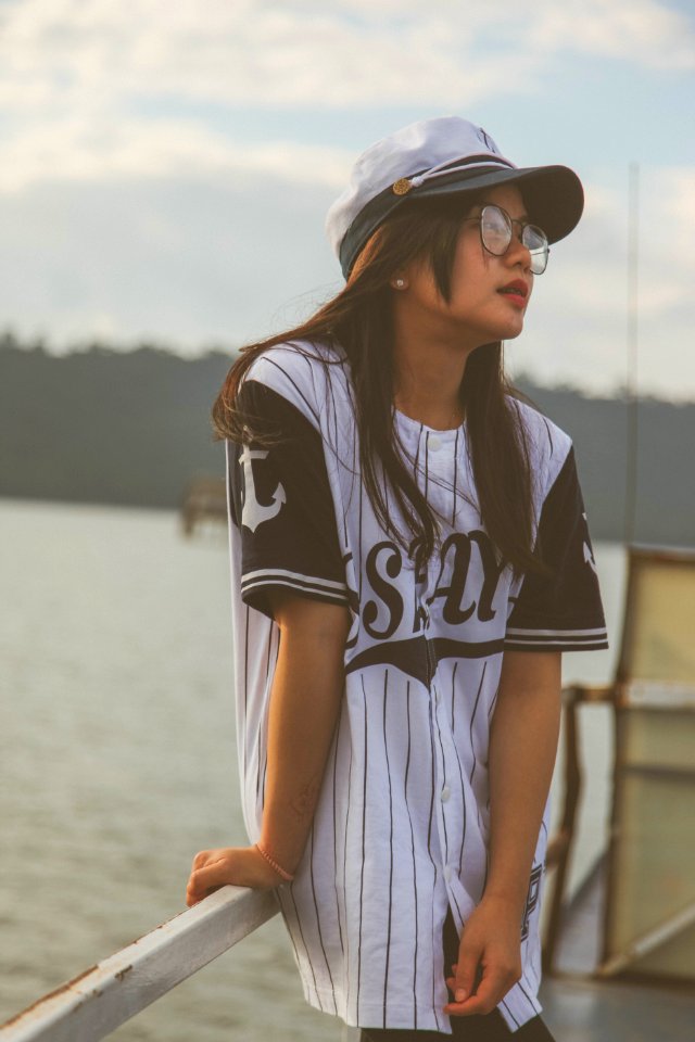 Woman Wearing White-and-black Cap And Crew-neck T-shirt