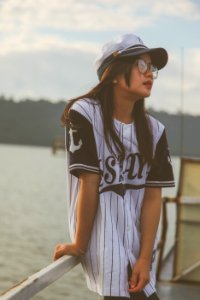 Woman Wearing White-and-black Cap And Crew-neck T-shirt