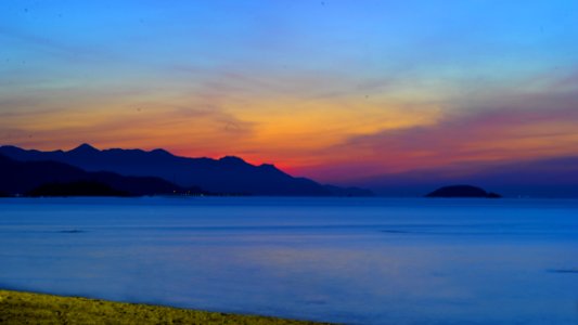 Photo Of Ocean Apart From Mountain