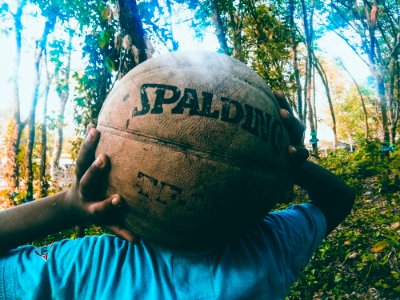 Person Holding Brown Spalding Basketball