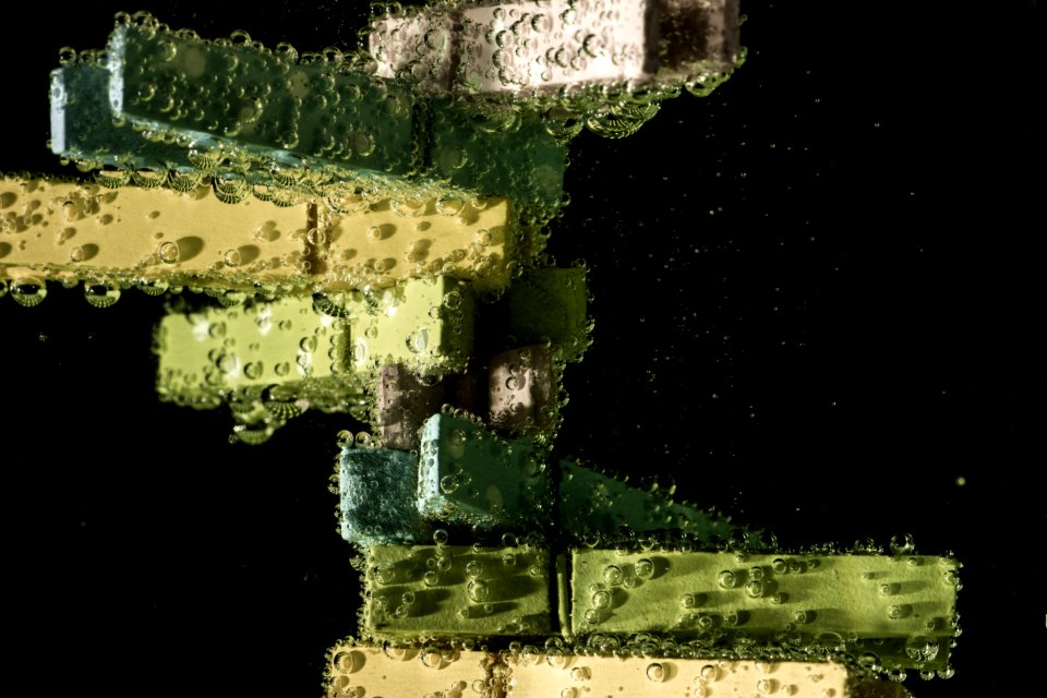 Green And Beige Clothes Clip On Water With Bubble Effect