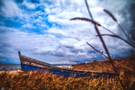Blue Canoe Under The Blue Sky