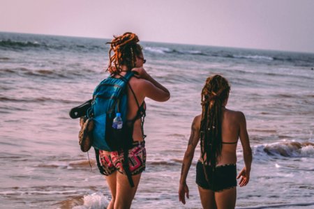 Two Woman Wearing Bikini Beside Seashore photo