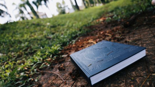 Black Book On Brown Floor photo