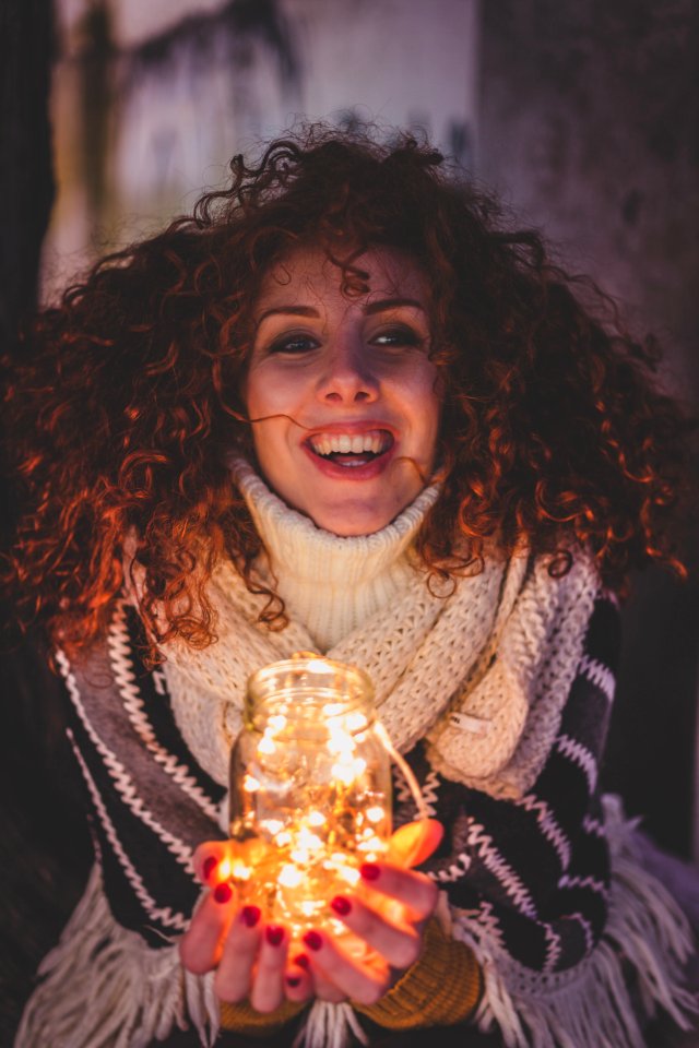 Woman Holding A Jar With String Lights
