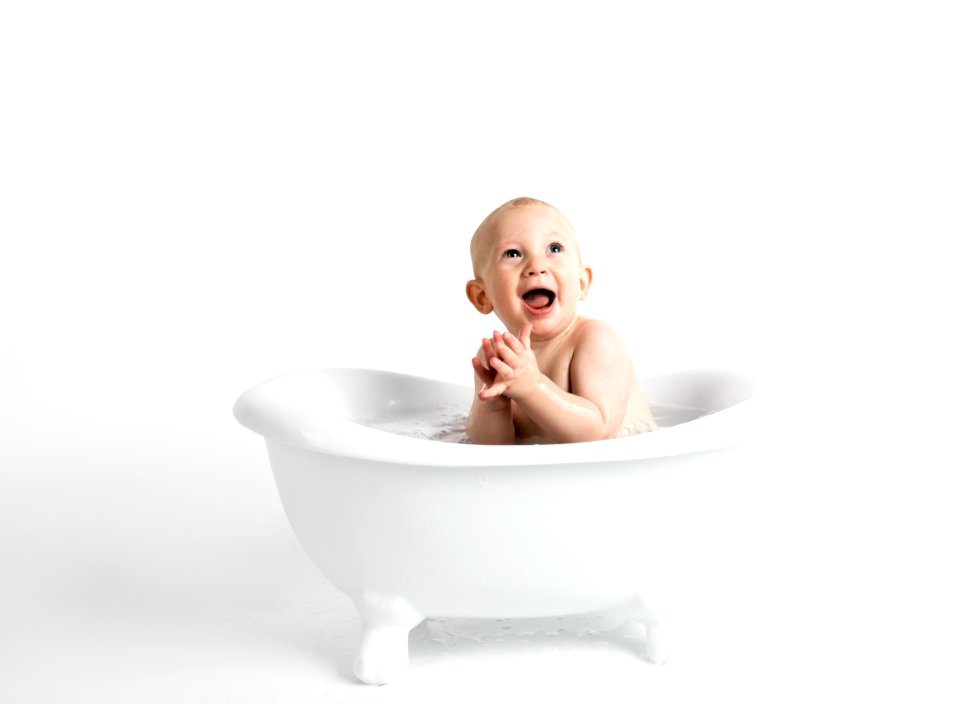Baby Inside White Bathtub With Water