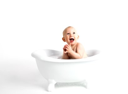 Baby Inside White Bathtub With Water