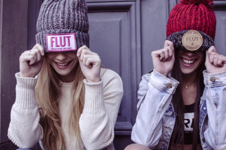 Two Womens Gray And Red Flut Knit Caps photo