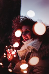 Woman Wearing Brown Leather Jacket And Knitted Scarf photo