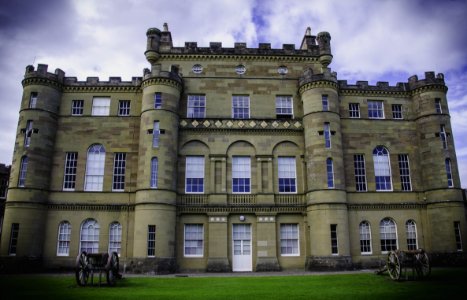 Low Angle Photo Of Brown Castle Surrounded By Green Grass