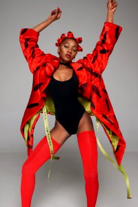 Woman In Red Coat Wearing Monokini And Red Stockings