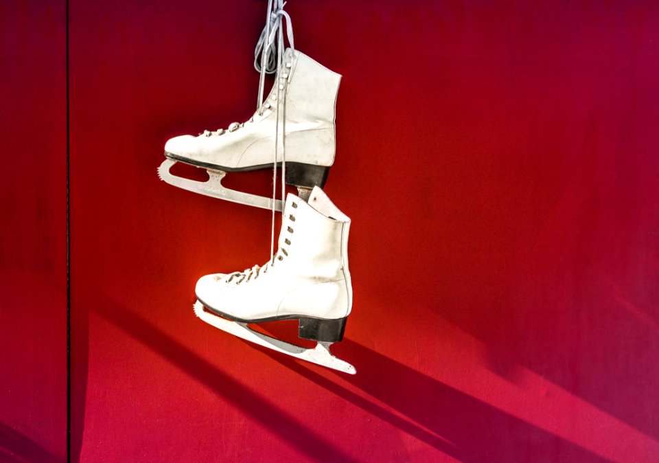 Hanged Pair Of White Leather Figure Skates