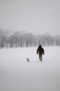 Photo Of Man Wearing Black Jacket And Pants Walking On Snow photo