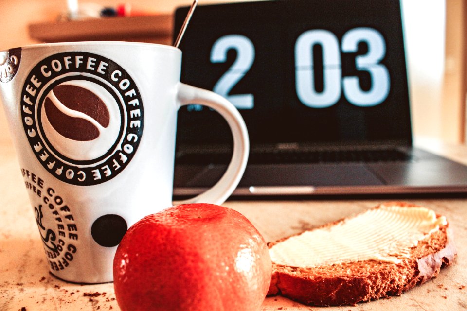 Closeup Photo Of White And Black Printed Ceramic Mug Beside Pastry