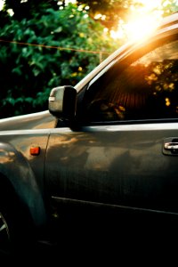 Selective Focus Photography Of Green Vehicle