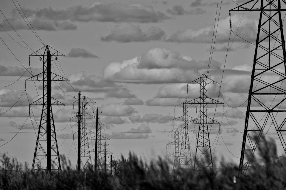 Grayscale Photo Of Electricity Towers