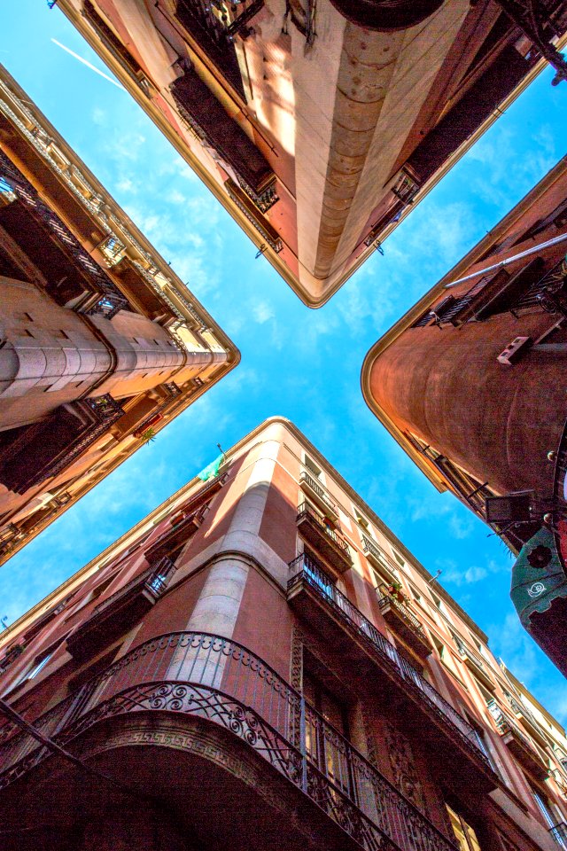 Low Angle Photo Of Four Brown Concrete Buildings photo