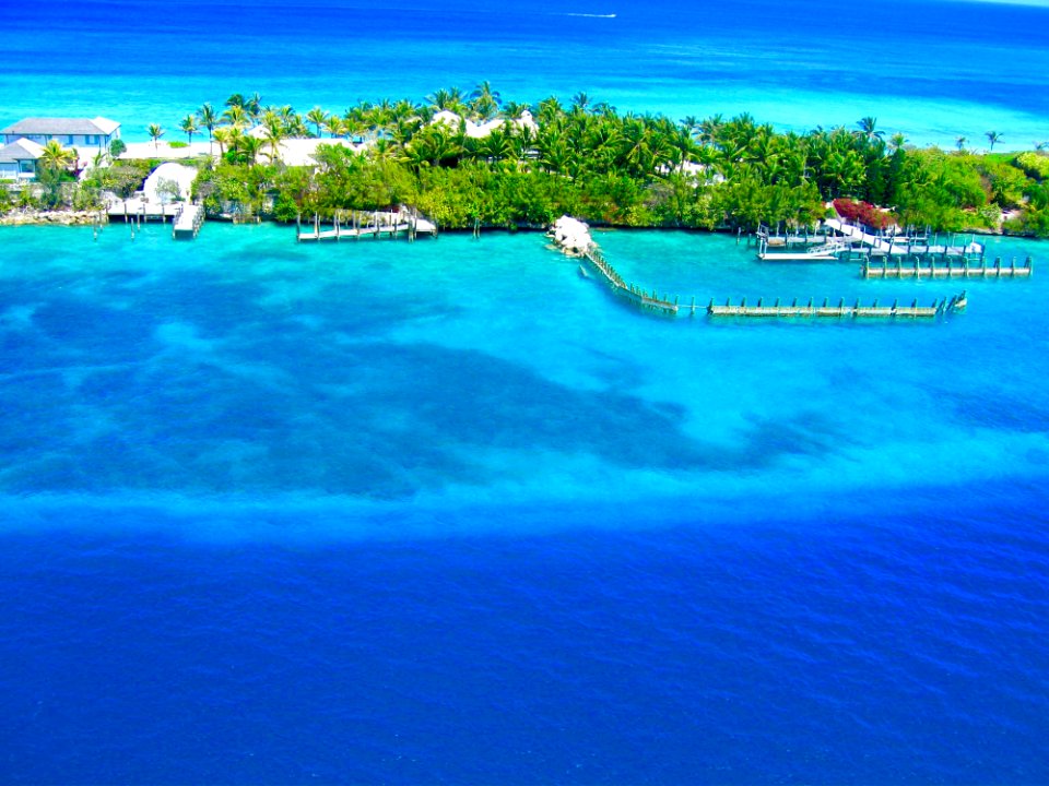 Landscape Photography Of Island Surrounded Body Of Water