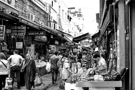 Grayscale Photo Of People In The Market photo