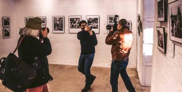 Photographers In A Photo Gallery