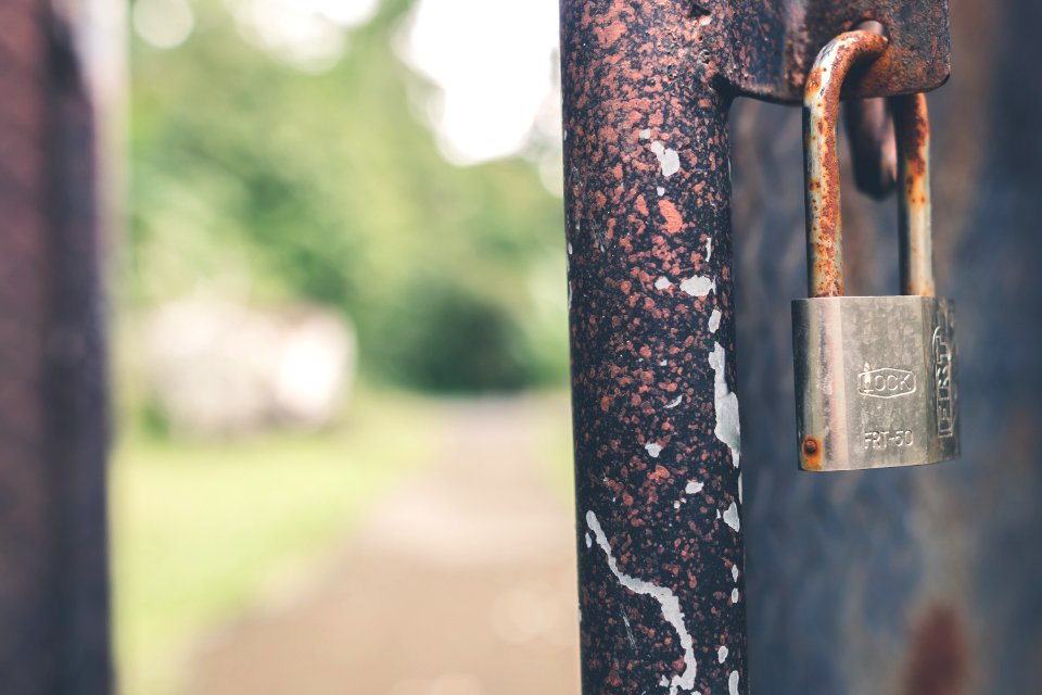 Rusted Grey Padlock In Selective-focus Photography photo