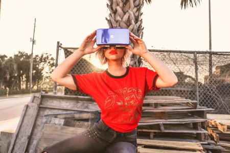 Woman In Red Crew-neck T-shirt Wearing Virtual Reality Glasses photo