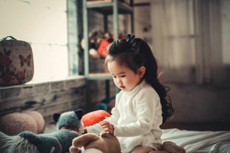 Photography Of A Baby Girl Playing