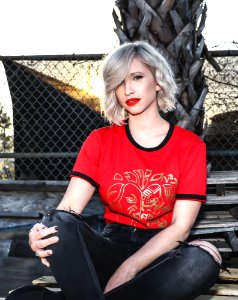 Woman In Red Crew-neck Shirt Sitting In Bench photo