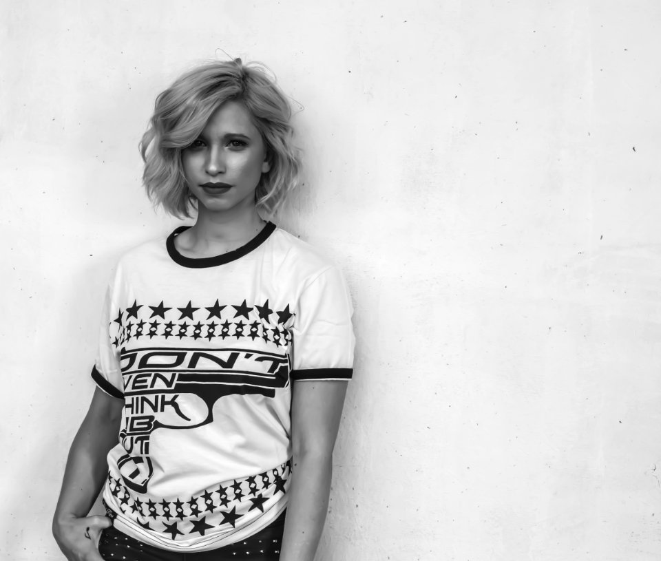 Woman Wearing White Labeled Shirt In Grayscale Photography