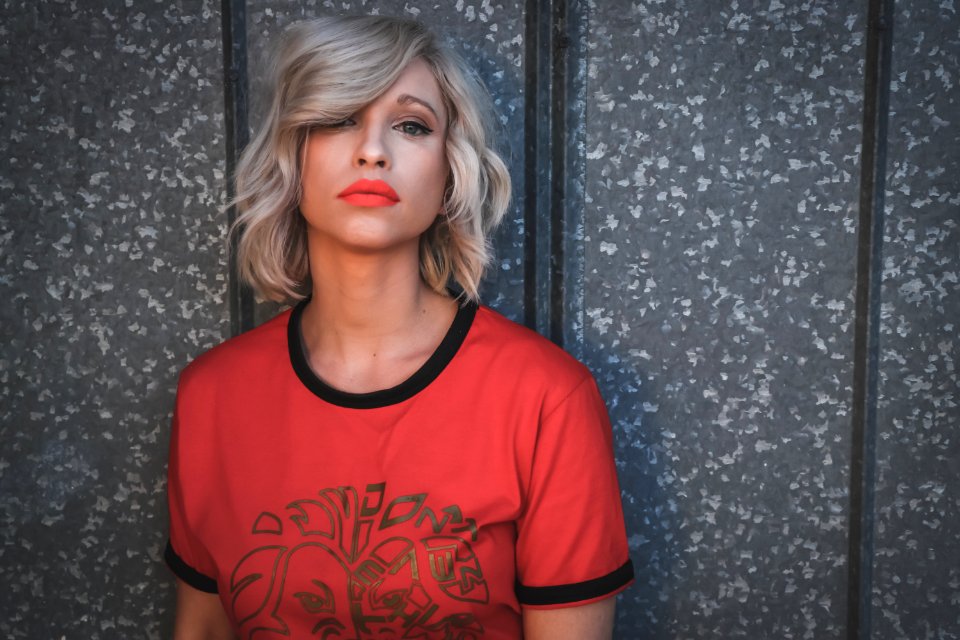 Woman Wearing Red Shirt On Gray Background